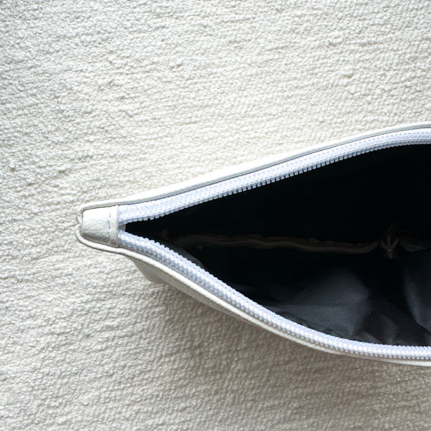 Smiley embroidered pouch Medium Size White x Sirver